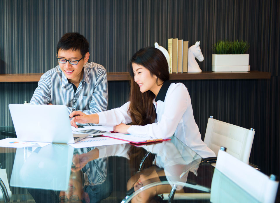 GI Techware IT specialists collaborating to provide holistic solutions to clients
